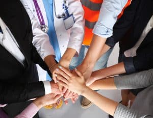 Occupational Medicine doctor and workers hands
